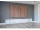 Modern media wall with built-in cabinetry and wood paneling at 13370 Alderley Dr, Orlando, FL 32832