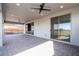 Covered patio with paver stones, ceiling fan, and sliding glass doors at 13370 Alderley Dr, Orlando, FL 32832