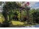 Wooden pergola covered in lush greenery at 13370 Alderley Dr, Orlando, FL 32832