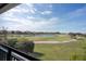 Scenic golf course and community view from covered patio at 13370 Alderley Dr, Orlando, FL 32832