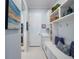 Well-organized mudroom with built-in storage cabinets, a bench, and shelving for added convenience at 15312 Gilligan Ct, Winter Garden, FL 34787