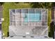 Overhead view of the house and screened pool at 1555 Palmero Way, Davenport, FL 33896