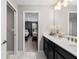 Bathroom with double vanity and view of bedroom at 1555 Palmero Way, Davenport, FL 33896