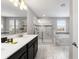 Elegant bathroom featuring double vanity, shower, and separate tub at 1555 Palmero Way, Davenport, FL 33896