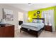 Bedroom with a queen bed and en-suite bathroom at 1555 Palmero Way, Davenport, FL 33896