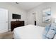 Bedroom with a dresser and en-suite bathroom at 1555 Palmero Way, Davenport, FL 33896