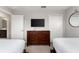 Bedroom with twin beds and dresser at 1555 Palmero Way, Davenport, FL 33896