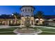 Elegant community clubhouse with a fountain in the courtyard at 1555 Palmero Way, Davenport, FL 33896