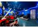 Fun game room, featuring racing games and a home theater at 1555 Palmero Way, Davenport, FL 33896