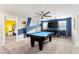 Game room with pool table, TV, and access to bedroom at 1555 Palmero Way, Davenport, FL 33896