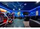Entertain in this themed game room with racing games and theater seating at 1555 Palmero Way, Davenport, FL 33896