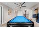 Play pool in this spacious game room with multiple access points at 1555 Palmero Way, Davenport, FL 33896