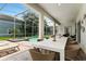 Patio with dining table overlooking the pool at 1555 Palmero Way, Davenport, FL 33896