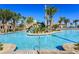Resort-style pool with a waterslide and plenty of lounge chairs at 1555 Palmero Way, Davenport, FL 33896