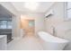 Elegant bathroom with a soaking tub and marble finishes at 159 Flomich St, Daytona Beach, FL 32117