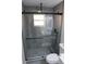 Updated bathroom with a large glass shower and modern fixtures at 17211 Se 160Th Avenue Rd, Weirsdale, FL 32195