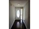 Light and bright entryway with an oval window at 17211 Se 160Th Avenue Rd, Weirsdale, FL 32195
