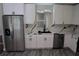 White cabinets, quartz countertops, and stainless steel appliances at 17211 Se 160Th Avenue Rd, Weirsdale, FL 32195