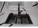 Modern kitchen sink with black matte faucet and dual basins at 17211 Se 160Th Avenue Rd, Weirsdale, FL 32195
