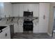 Modern kitchen featuring white cabinets and quartz countertops at 17211 Se 160Th Avenue Rd, Weirsdale, FL 32195