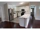 Modern kitchen with island and stainless steel appliances at 17211 Se 160Th Avenue Rd, Weirsdale, FL 32195