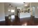 Open living room with hardwood floors and kitchen island at 17211 Se 160Th Avenue Rd, Weirsdale, FL 32195