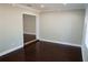 Spacious living room with dark hardwood floors at 17211 Se 160Th Avenue Rd, Weirsdale, FL 32195