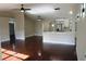 Open living room with hardwood floors and kitchen island at 17211 Se 160Th Avenue Rd, Weirsdale, FL 32195