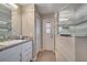 Bathroom with a large walk-in shower and updated vanity at 1748 Christina Lee Lane, St Cloud, FL 34769