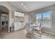 Bright dining area with table and chairs, wood flooring, and built-in cabinetry at 1748 Christina Lee Lane, St Cloud, FL 34769