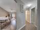 Hallway with wood-look flooring and views into the living and dining areas at 1748 Christina Lee Lane, St Cloud, FL 34769
