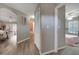 Hallway with light gray walls, wood-look flooring, and access to bedrooms at 1748 Christina Lee Lane, St Cloud, FL 34769