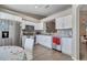 Modern kitchen with stainless steel appliances and white cabinetry at 1748 Christina Lee Lane, St Cloud, FL 34769