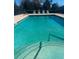Inviting community pool with steps and lounge chairs at 1748 Christina Lee Lane, St Cloud, FL 34769