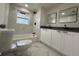 Modern bathroom with double vanity, marble tile, and new fixtures at 1821 Rogers Ave, Maitland, FL 32751