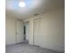 Simple bedroom with gray flooring and spacious closet at 1821 Rogers Ave, Maitland, FL 32751