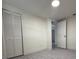 Bright bedroom with grey flooring and built-in closet at 1821 Rogers Ave, Maitland, FL 32751