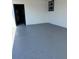 Spacious garage with grey epoxy flooring at 1821 Rogers Ave, Maitland, FL 32751