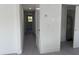 Bright hallway with gray flooring and access to other rooms at 1821 Rogers Ave, Maitland, FL 32751