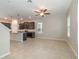 Open concept dining area with tile floors and ceiling fan at 1997 Standing Rock Cir, Oakland, FL 34787