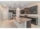 Spacious kitchen featuring stainless steel appliances and granite island at 1997 Standing Rock Cir, Oakland, FL 34787