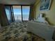 Bedroom with ocean view and comfortable bedding at 2301 S Atlantic Ave # 240, Daytona Beach, FL 32118