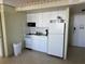 Small kitchen with white cabinets at 2301 S Atlantic Ave # 240, Daytona Beach, FL 32118