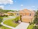 Two-story house with a large yard and a two-car garage at 2501 Dharma Cir, Kissimmee, FL 34746