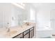 Bathroom boasts a large vanity, soaking tub, and shower at 2501 Dharma Cir, Kissimmee, FL 34746