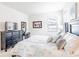 Second bedroom with king-size bed, dresser, and window at 2501 Dharma Cir, Kissimmee, FL 34746