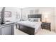 Spacious Primary bedroom with king-size bed and ensuite bathroom at 2501 Dharma Cir, Kissimmee, FL 34746