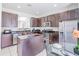 Spacious kitchen with dark brown cabinets and stainless steel appliances at 2501 Dharma Cir, Kissimmee, FL 34746
