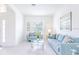 Light and airy living room with light blue sofas and a glass coffee table at 2501 Dharma Cir, Kissimmee, FL 34746