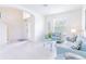 Bright living room with a view of the front door and staircase at 2501 Dharma Cir, Kissimmee, FL 34746